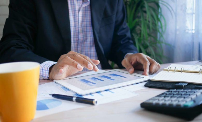 Man viewing financial information on a tablet