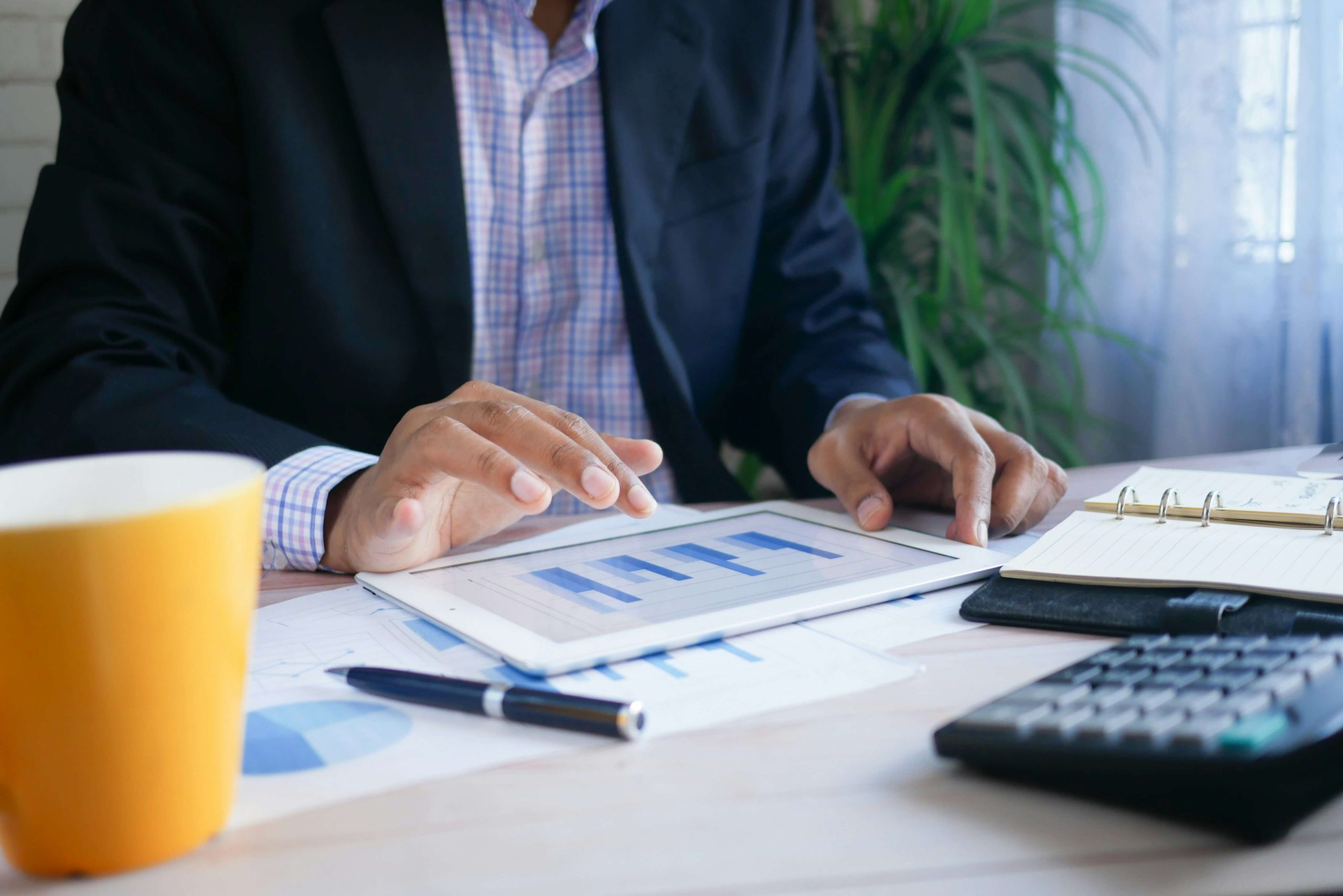 Man viewing financial information on a tablet