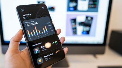 Phone displaying a personal spending app with latest activities using ai for credit analysis.